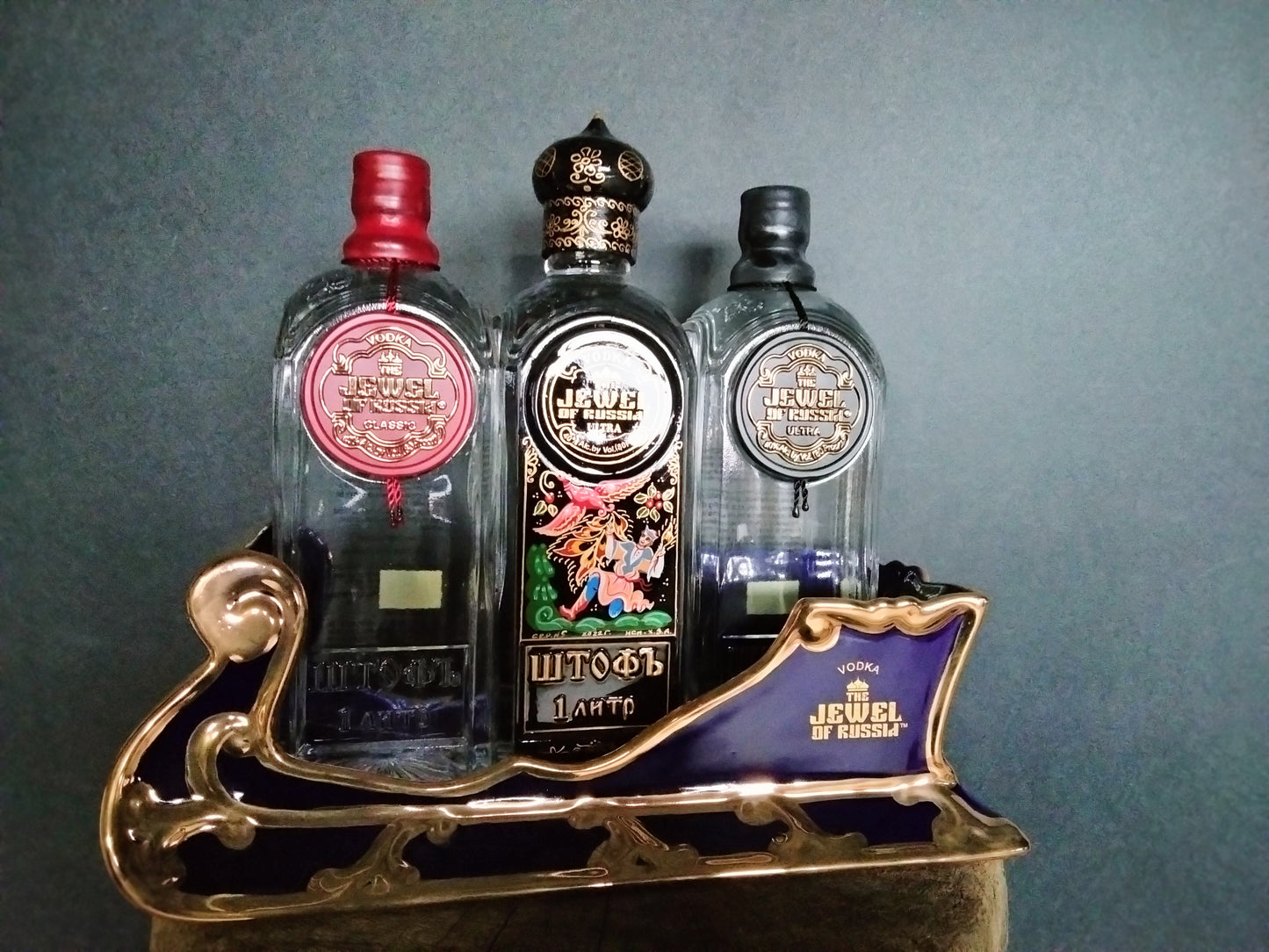 The Jewel Of Russia Vodka handmade porcelain cobalt blue sled with a true gold paint trim