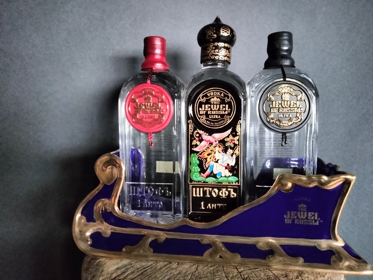 The Jewel Of Russia Vodka handmade porcelain cobalt blue sled with a true gold paint trim