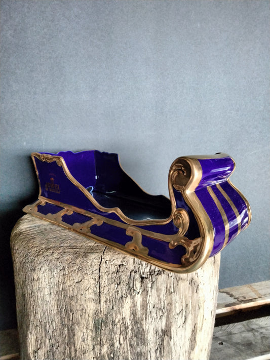 The Jewel Of Russia Vodka handmade porcelain cobalt blue sled with a true gold paint trim