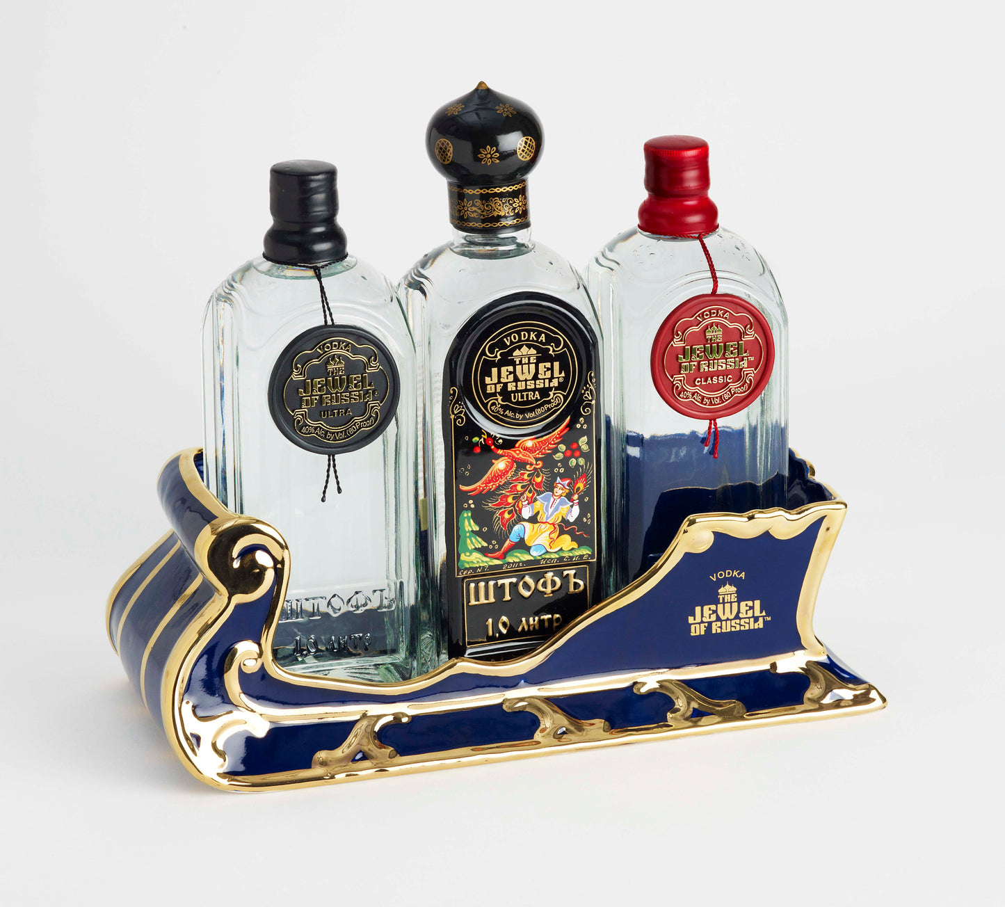 The Jewel Of Russia Vodka handmade porcelain cobalt blue sled with a true gold paint trim