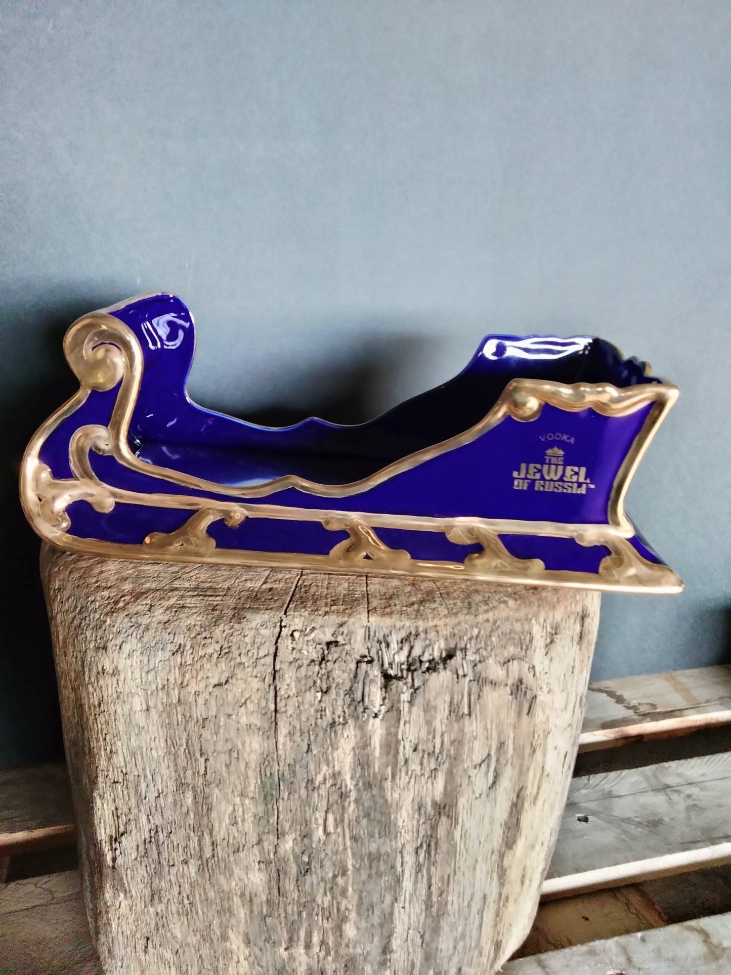 The Jewel Of Russia Vodka handmade porcelain cobalt blue sled with a true gold paint trim - Jewel of Russia