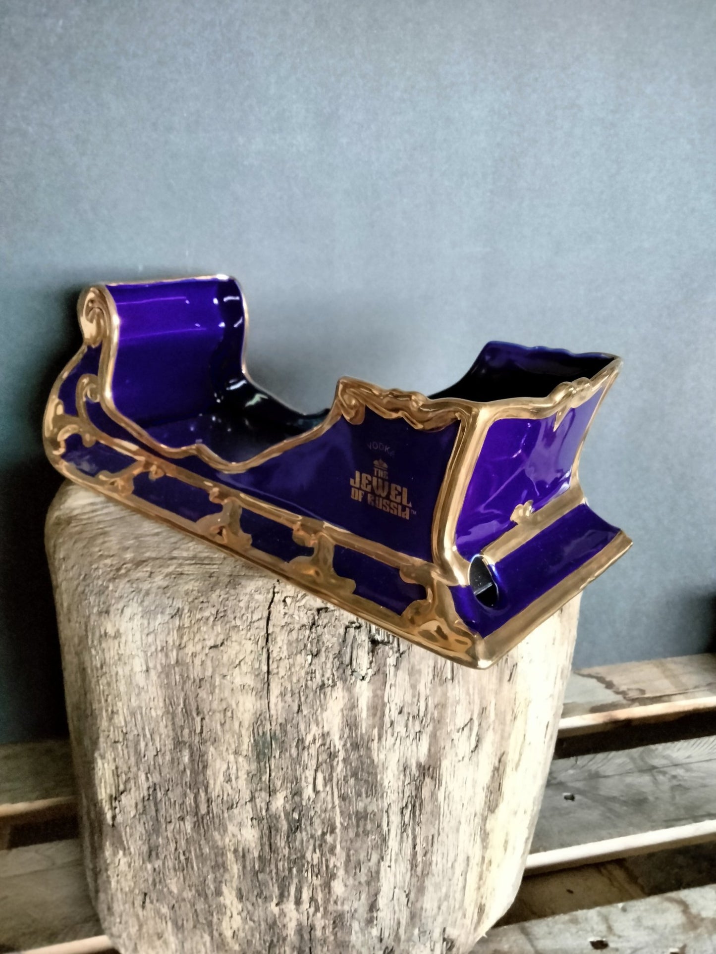 The Jewel Of Russia Vodka handmade porcelain cobalt blue sled with a true gold paint trim - Jewel of Russia