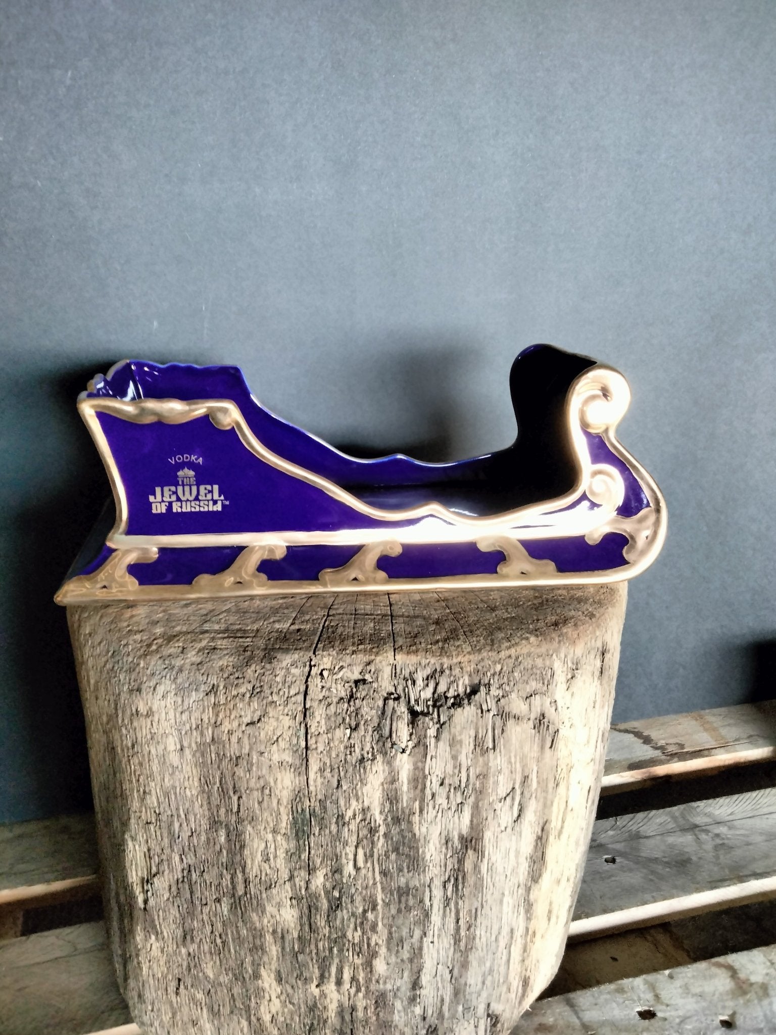 The Jewel Of Russia Vodka handmade porcelain cobalt blue sled with a true gold paint trim - Jewel of Russia