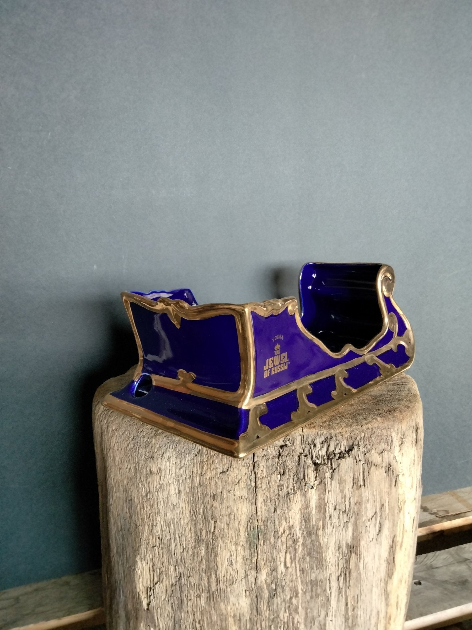 The Jewel Of Russia Vodka handmade porcelain cobalt blue sled with a true gold paint trim - Jewel of Russia