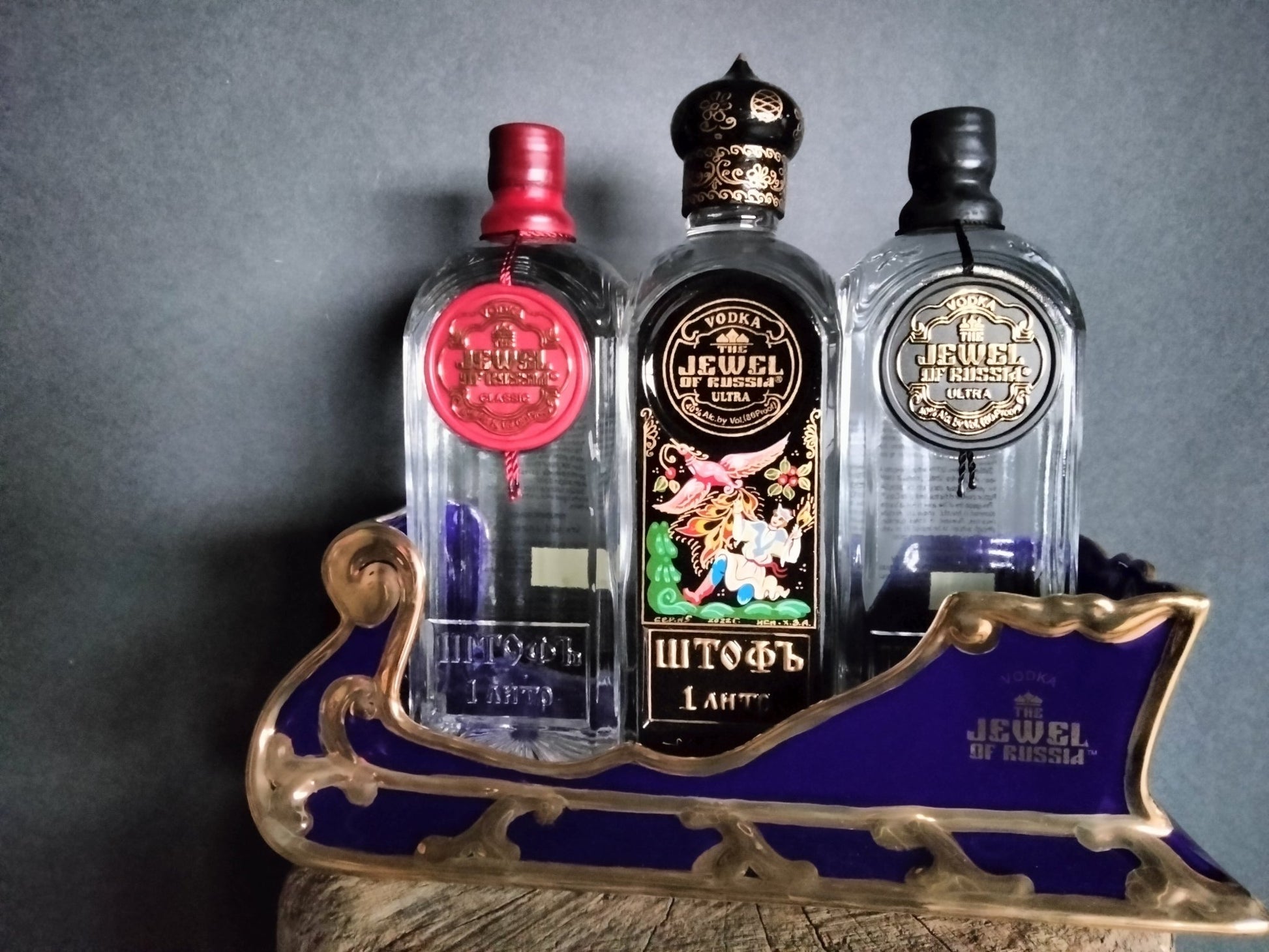 The Jewel Of Russia Vodka handmade porcelain cobalt blue sled with a true gold paint trim - Jewel of Russia
